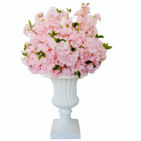 Pink cherry blossoms on a white planter 50 inch tall